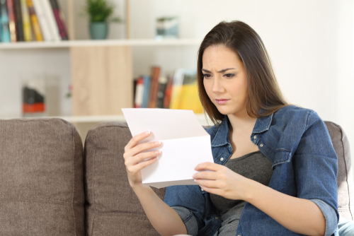 woman reading eviction notice