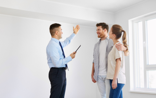 realtor showing couple home